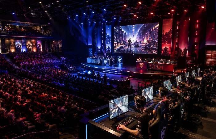 Professional esports arena with tournament stage and gaming stations