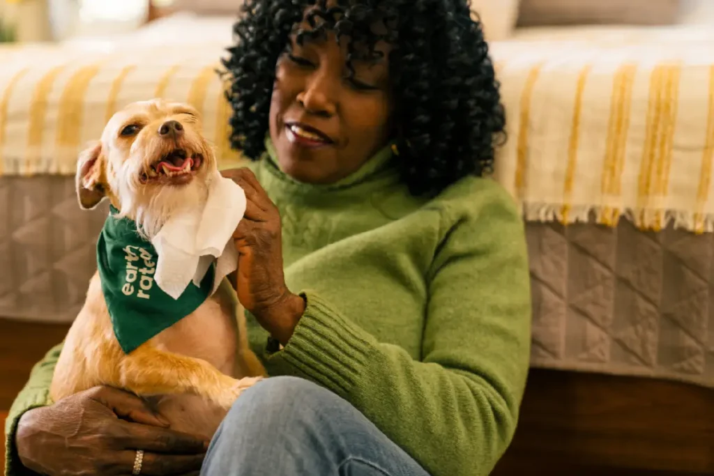 Pet owner caring for a dog at home