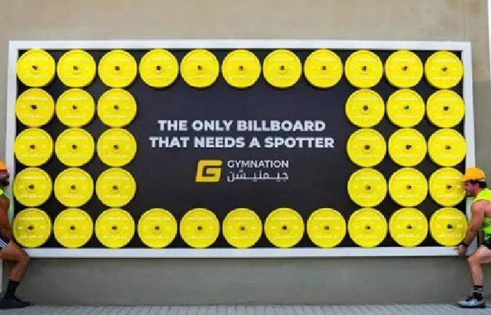 Gymnation high-contrast billboard that needs a spotter